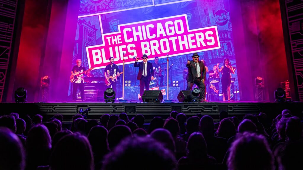 The Chicago Blues Brothers performing live on stage in a theatre